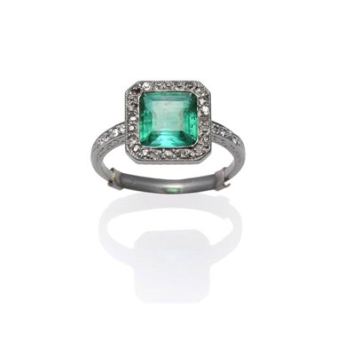 Lot 442 - An Art Deco Emerald and Diamond Ring, the step cut emerald within a border of old cut diamonds, the