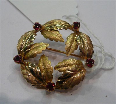 Lot 224 - A ruby wreath brooch, stamped '750'