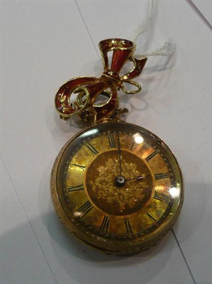 Lot 246 - A lady's fob watch on a red enamelled bow brooch