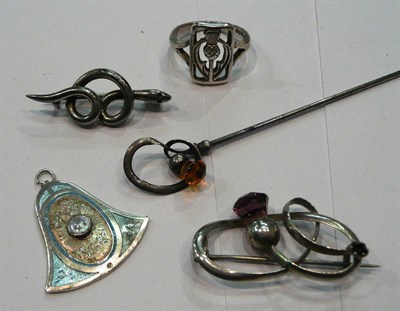 Lot 247 - Charles Horner enamel decorated bell shaped pendant, hat pin, pierced thistle ring and two brooches