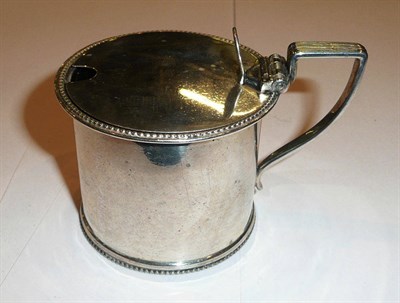 Lot 253 - Silver mustard pot with blue glass liner