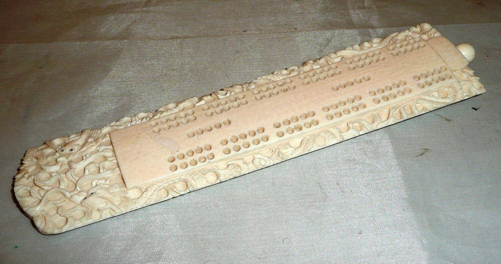 Lot 334 - Carved ivory cribbage board