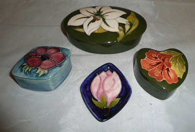 Lot 361 - Four pieces of Walter Moorcroft pottery - coral hibiscus box, anemone box, magnolia dish and...