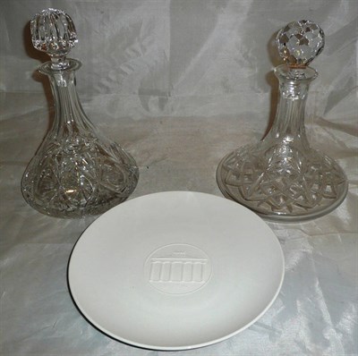 Lot 382 - Two cut glass 'Ship's' decanters and stoppers and a boxed Berlin white porcelain plate