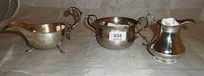 Lot 434 - A silver sauce boat, milk jug and sugar bowl