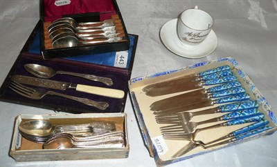 Lot 443 - Silver teaspoons, plated spoons and a cup and saucer 'A present from Newcastle upon Tyne'