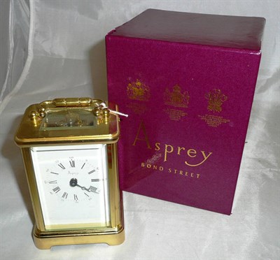 Lot 445 - A brass carriage timepiece retailed by Asprey