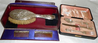 Lot 446 - A cased silver Christening set and cased silver backed brush and comb