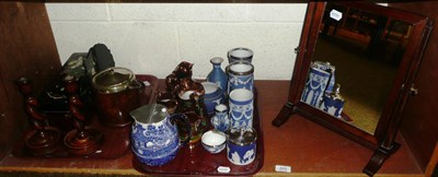 Lot 455 - Tray of Wedgwood, copper lustre etc, pair of oak candlesticks, mirror etc on a shelf