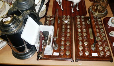 Lot 472 - Pair of large plated flagons, two oak presentation stands with plated communion cups, two pipes etc