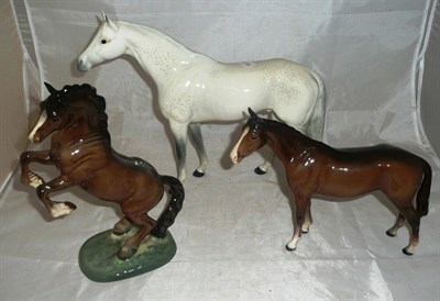 Lot 476 - Beswick dapple grey hunter, rearing bay horse and another