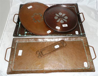 Lot 486 - Two Arts & Crafts copper rectangular trays both stamped 'JP' and three others