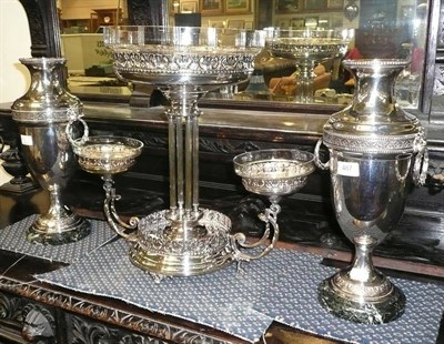 Lot 487 - A large silver plated epergne with cut glass bowls, also a pair of the matching urns with...