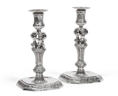 Lot 473 - A Pair of Victorian Cast Silver Candlesticks, R & S Garrard & Co, London 1898, on square bases with