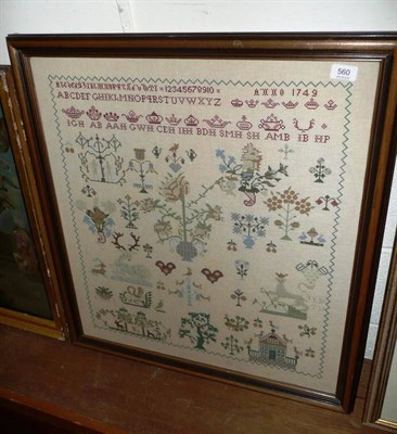 Lot 560 - A modern framed woolwork sampler