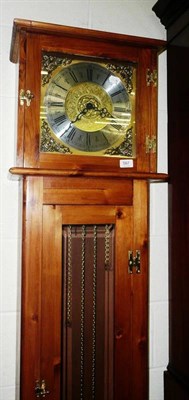 Lot 567 - A modern thirty hour longcase clock in a pine case