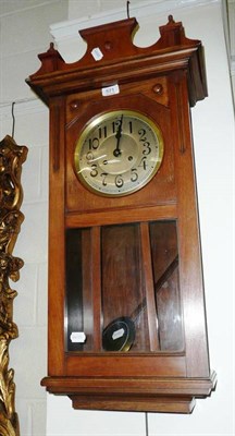 Lot 571 - A walnut wall clock