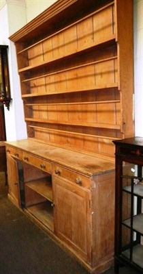 Lot 590 - A large Victorian pine dresser base with later rack