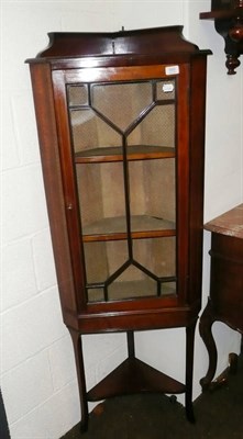 Lot 593 - Edwardian inlaid glazed corner cabinet on stand