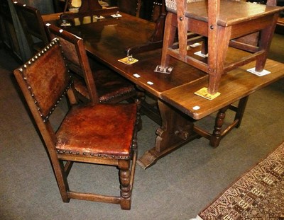 Lot 595 - Oak refectory table and set of six oak and leather dining chairs