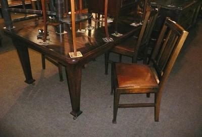 Lot 599 - Oak wind out dining table and four chairs