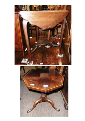 Lot 600 - A drop leaf two tier occasional table and a tripod table