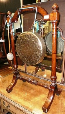 Lot 606 - Dinner gong on oak stand