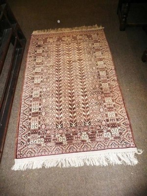 Lot 609 - A hand woven rug, 144cm by 86cm