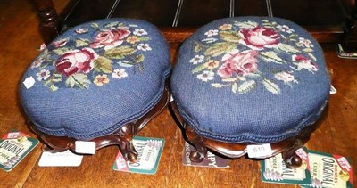 Lot 610 - Pair of carved mahogany footstools with wool work tops