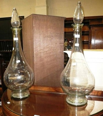 Lot 620 - Pair of glass carboys and covers