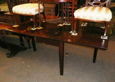 Lot 634 - 19th century mahogany drop leaf dining table