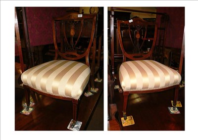 Lot 635 - A pair of inlaid nursing chairs stamped 'Maple and Co'