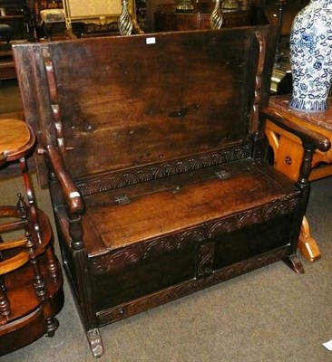 Lot 641 - Carved oak monks bench