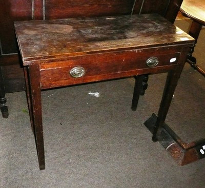 Lot 645 - A 19th century oak fold-over tea table with single drawer