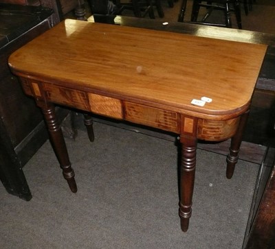 Lot 647 - An inlaid mahogany fold-over tea table