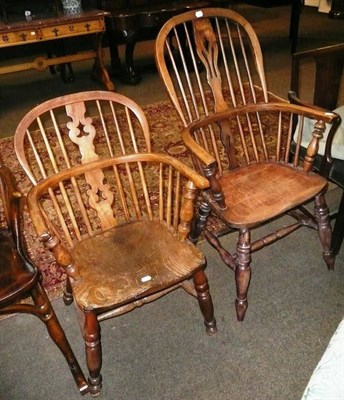 Lot 660 - An ash Windsor armchair and another similar