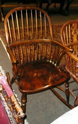 Lot 661 - An ash and elm Windsor arm chair with crinoline stretcher and rocker base