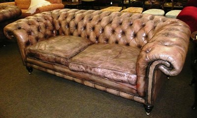 Lot 675 - Large leather Chesterfield settee