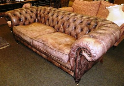 Lot 676 - A large leather Chesterfield settee