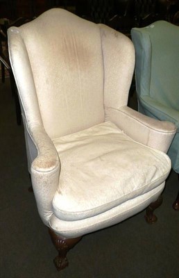 Lot 684 - Late 19th/early 20th century wing back chair on claw and ball feet