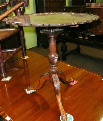 Lot 695 - Mahogany tripod occasional table on birdcage support with a shaped top