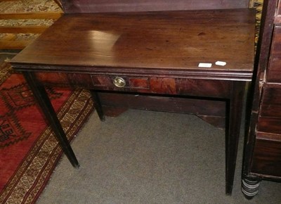 Lot 700 - Georgian mahogany fold-over tea table