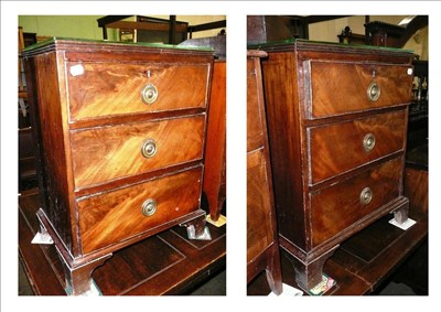 Lot 704 - Pair of small three height chests of drawers, with glass protectors