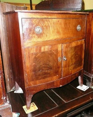 Lot 705 - An early 19th century bow front cabinet