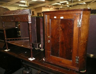 Lot 707 - A 19th century oak corner cabinet and a carved oak two tier corner table