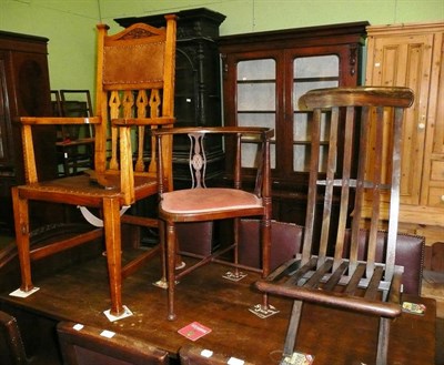 Lot 715 - Edwardian mahogany corner chair, an Arts & Crafts oak chair and a folding chair