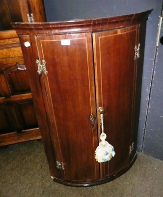 Lot 717 - Georgian bow front corner cabinet