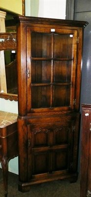 Lot 718 - A Titchmarsh and Goodwin oak standing corner cabinet