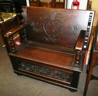 Lot 728 - A carved oak monk's bench