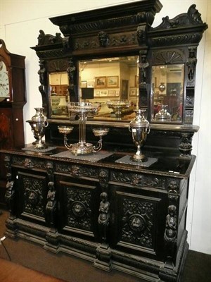 Lot 736 - A Victorian heavily carved oak mirror back sideboard